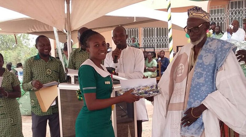 Miss Abiba receiving an award above for being the best student in her year class